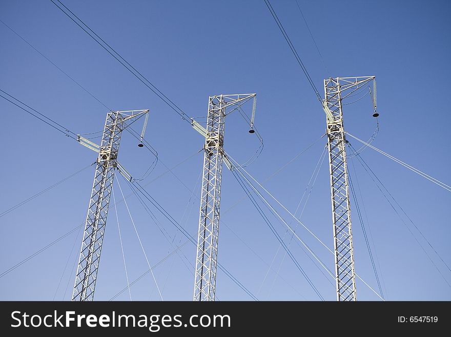 Power Lines Against Blue Sky