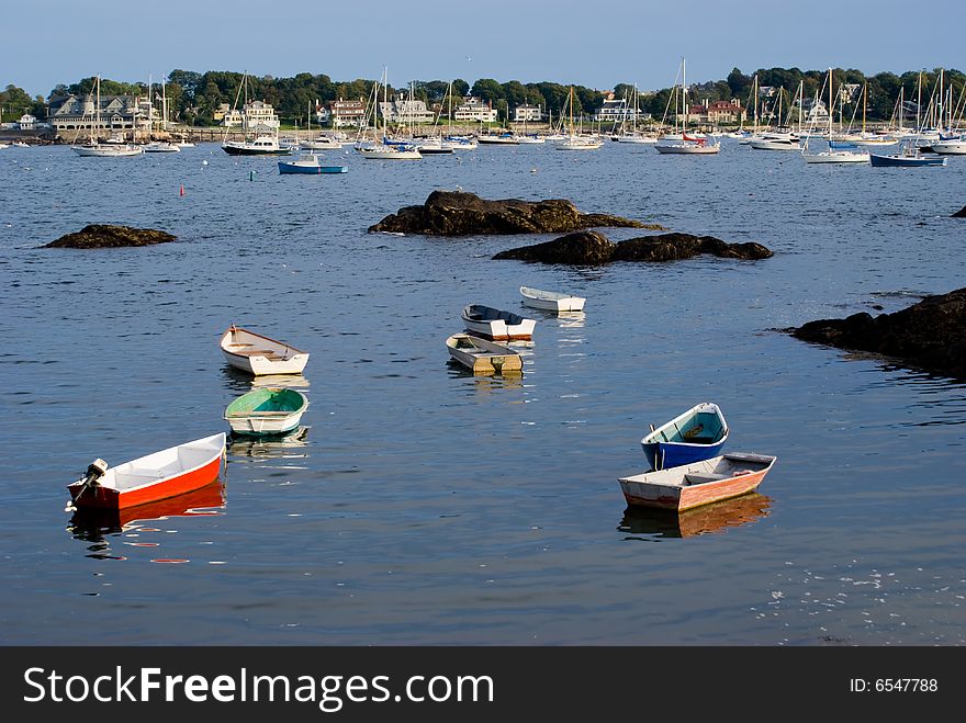 Scenic View of sailboats and dinghies in  Marblehead Neck Harbor. View from Fort Sewall cove at Marblehead Massachusetts. Scenic View of sailboats and dinghies in  Marblehead Neck Harbor. View from Fort Sewall cove at Marblehead Massachusetts