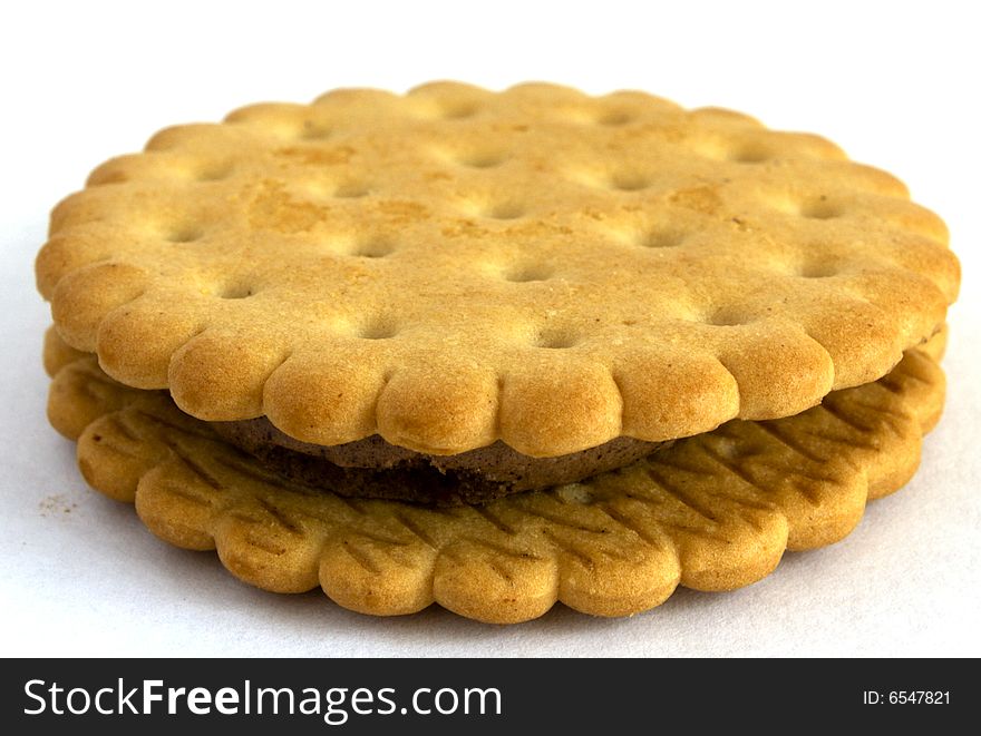 Cookies with a layer from nut paste, on a white background