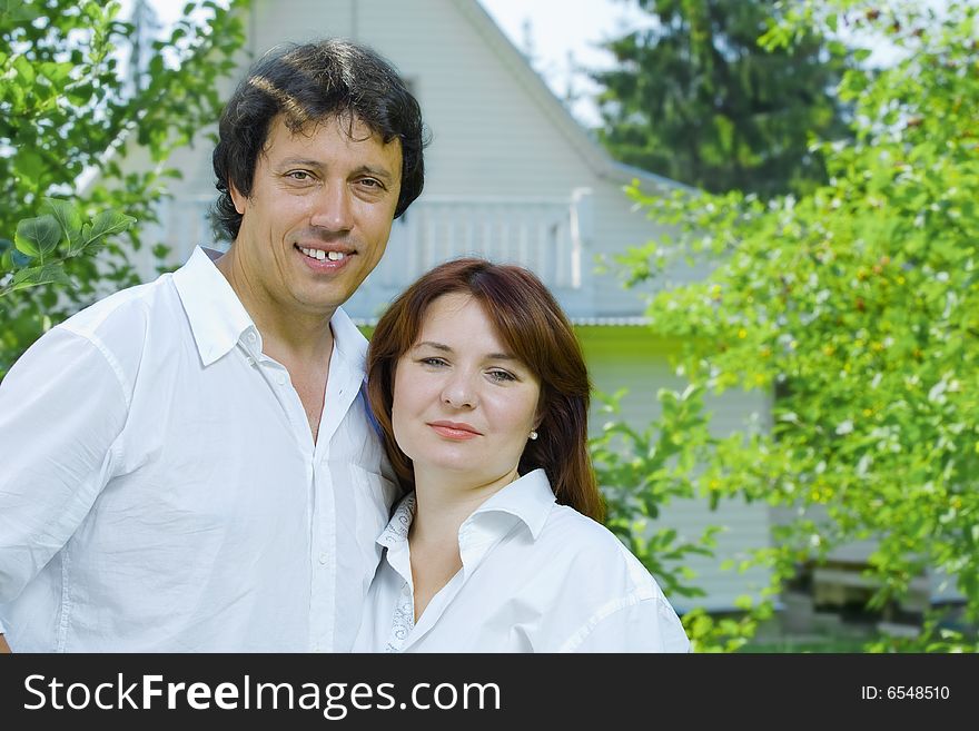 Portrait of young happy couple in summer environment