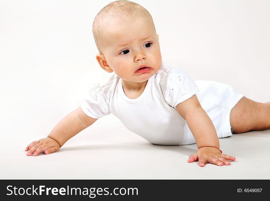 An image of a little baby  crawning in studio