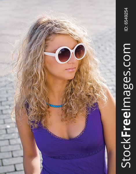 Beautiful girl with curly hair in sun glasses. Beautiful girl with curly hair in sun glasses