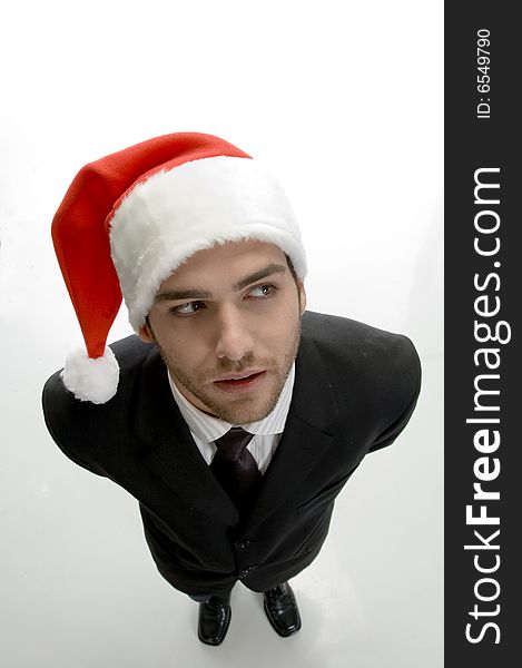 Top view pose young businessman wearing santa cap on an isolated white background