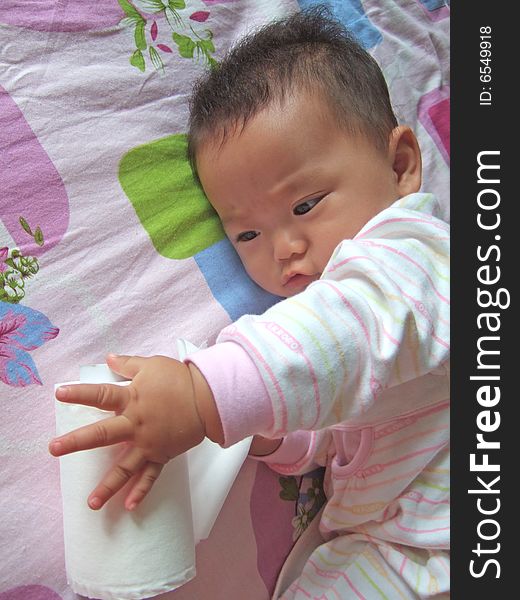 Baby Playing Paper