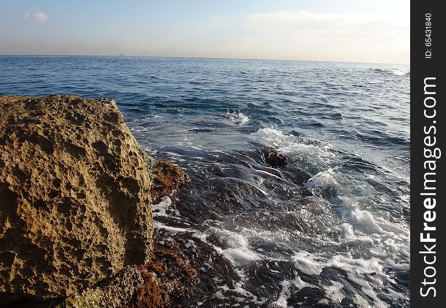 Big stone, sea and wave