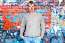 Young Stylish Man Stand Near Graffiti Brick Wall. Royalty Free Stock Photography Young Stylish Man Stand Near Graffiti Brick Wall. Royalty Free Stock Photography