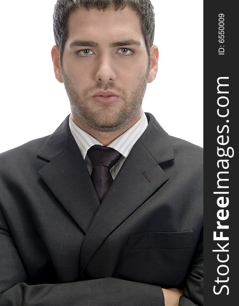 Businessman with folded hands looking to camera on an isolated white background