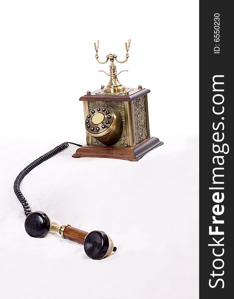 Vintage phone with picked up receiver on white background