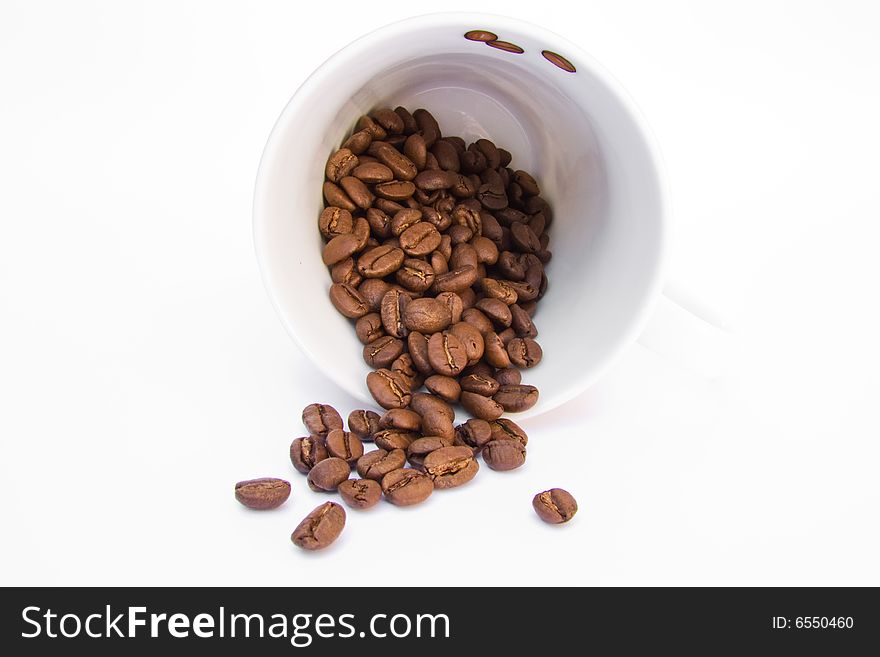 Coffee mug with beans on a white background