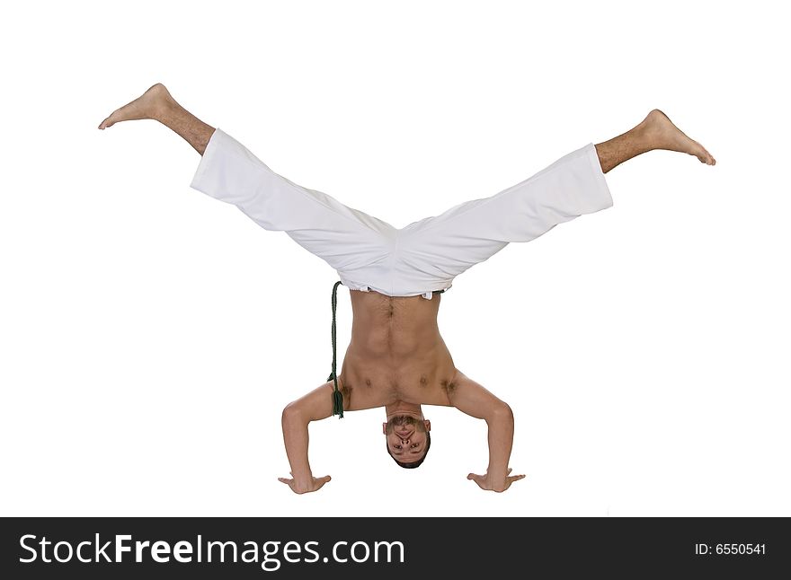 Young caucasian doing cartwheel against white background