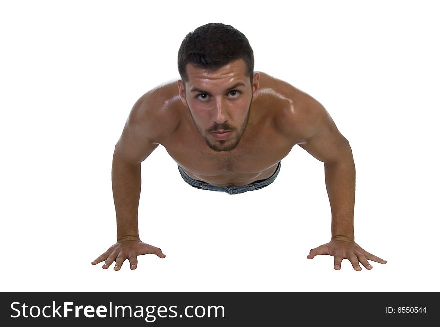 Handsome young male exercising on an isolated white background