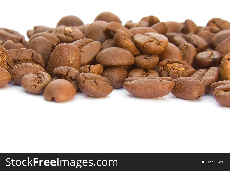 Lots of coffee beans on a white background