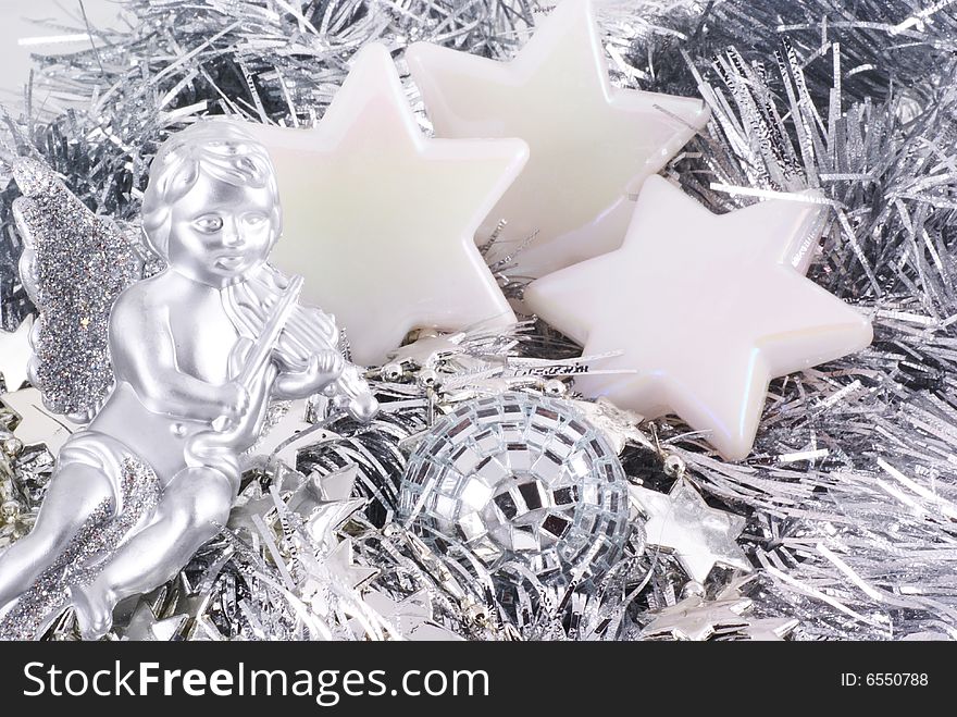 Close up of different kinds of silver christmas ornaments.