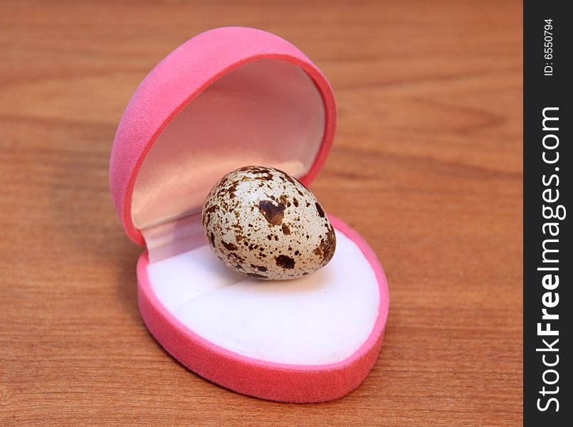 Quail egg on a wooden surface. Quail egg on a wooden surface
