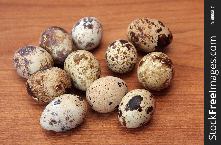 Quail eggs on a wooden surface