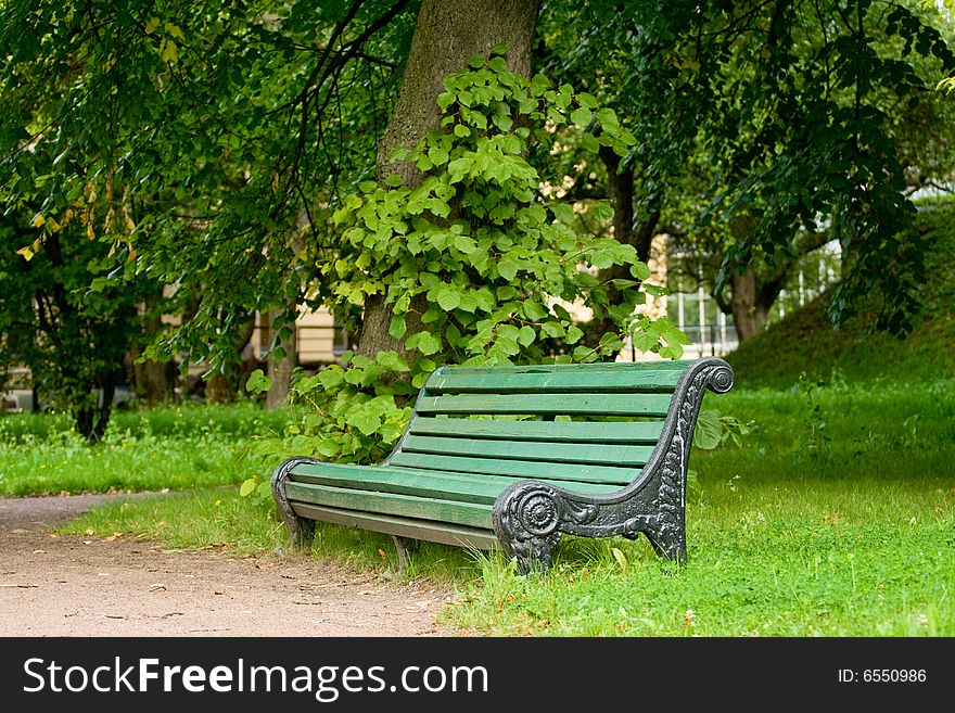 Empty green bench