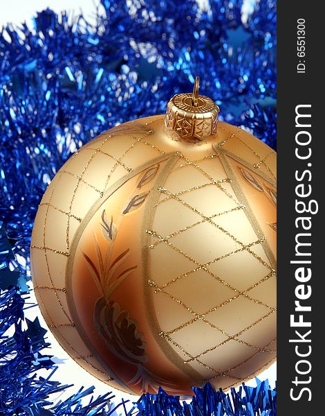 Golden bauble and blue chain , Christmas background