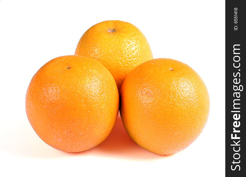 Three oranges on white background