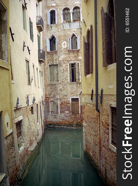 Quiet canal surrounded by residential buildings in Venezia, Italy. Quiet canal surrounded by residential buildings in Venezia, Italy