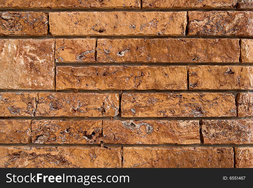 An ancient wall background made of red bricks