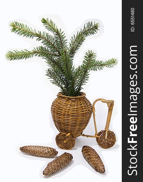 Fur-tree branch in bascket-toy and cones