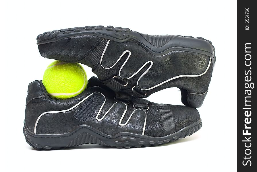 Black sport shoes and ball