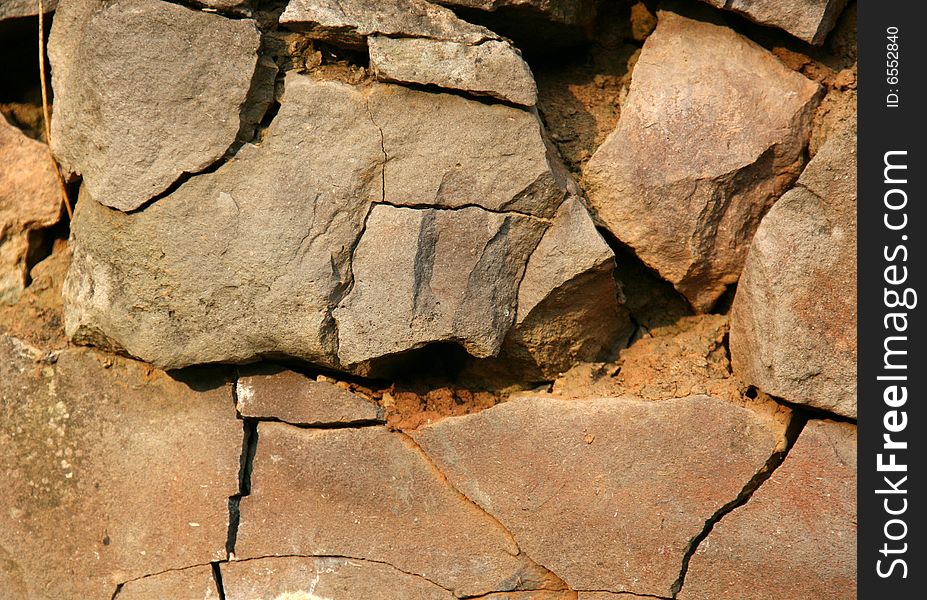 Wall from old granite sharp stones. Wall from old granite sharp stones