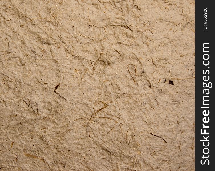 Rough textured crumbled paper with dark brown fibers. Rough textured crumbled paper with dark brown fibers