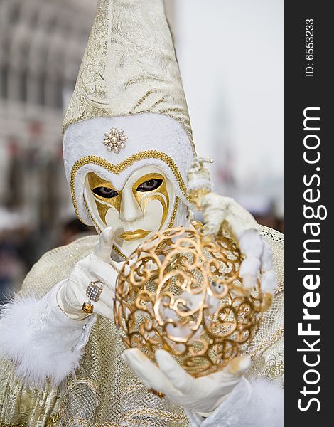 White and gold costume at the Venice Carnival. White and gold costume at the Venice Carnival