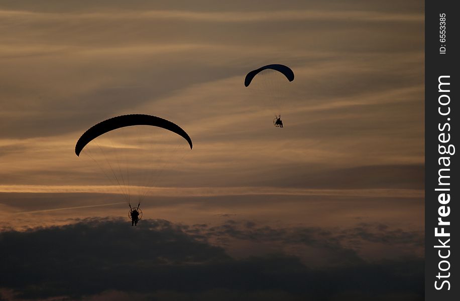 Paraglider Flight on dark cloudy. Paraglider Flight on dark cloudy