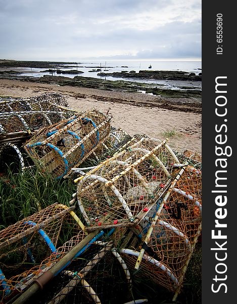 Seascape with lobster baskets in the foreground. Seascape with lobster baskets in the foreground