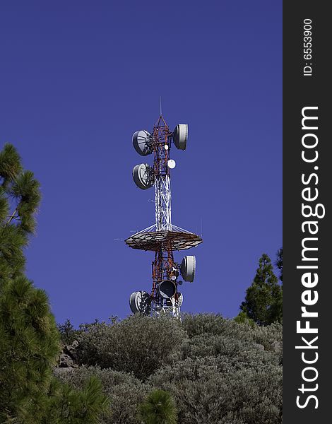 Telecommunications tower for broadcasting on perfect blue sky. Telecommunications tower for broadcasting on perfect blue sky