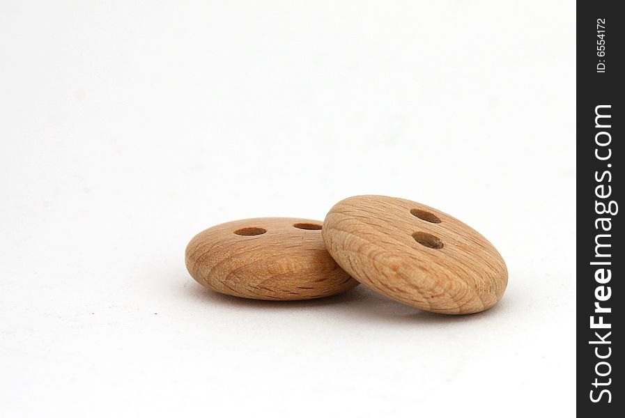 Two wooden buttons