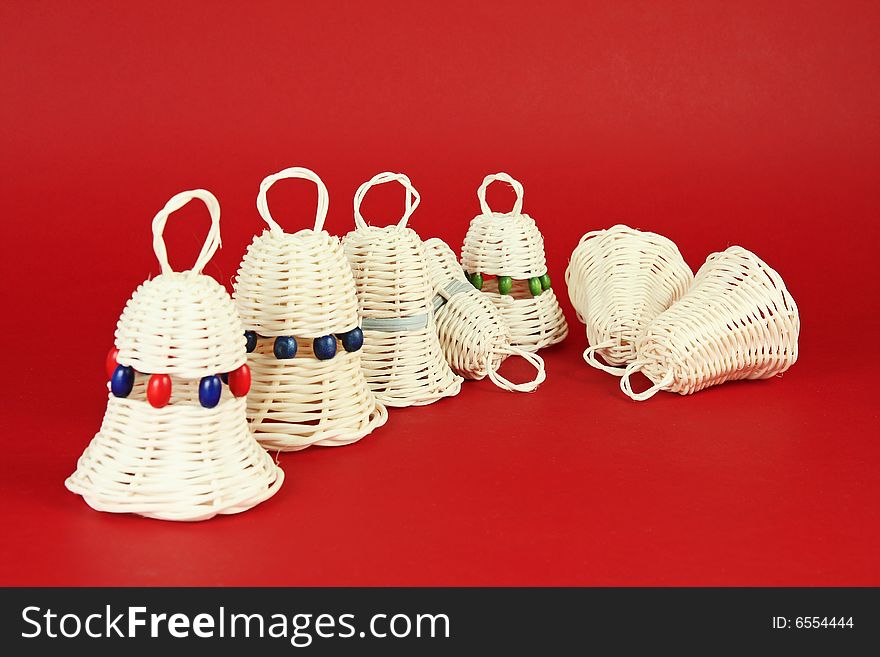 Nontraditional homemade christmas decorations - bells, red background. Nontraditional homemade christmas decorations - bells, red background