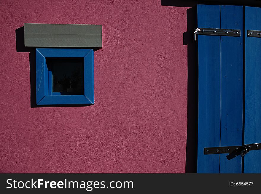 Window and the door of a funny little house. Window and the door of a funny little house.