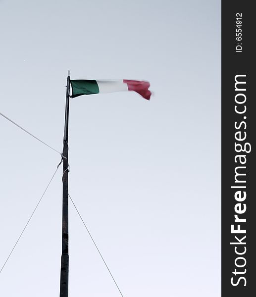 An Italian waving flag in a minimal composition. An Italian waving flag in a minimal composition.