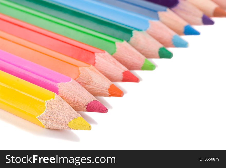 Close-up pencils in a row, isolated on white