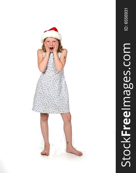 Cute girl in santa hat with her hands on her face. Cute girl in santa hat with her hands on her face