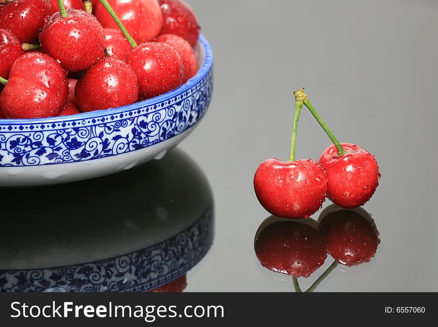 Cherry Heap with Blue Bowl on Glass