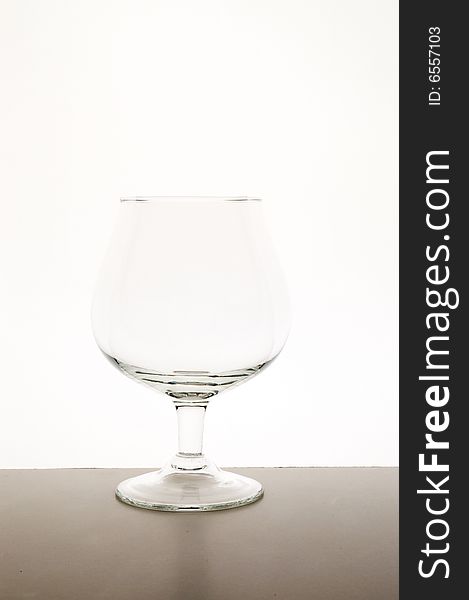 Empty glass against white background