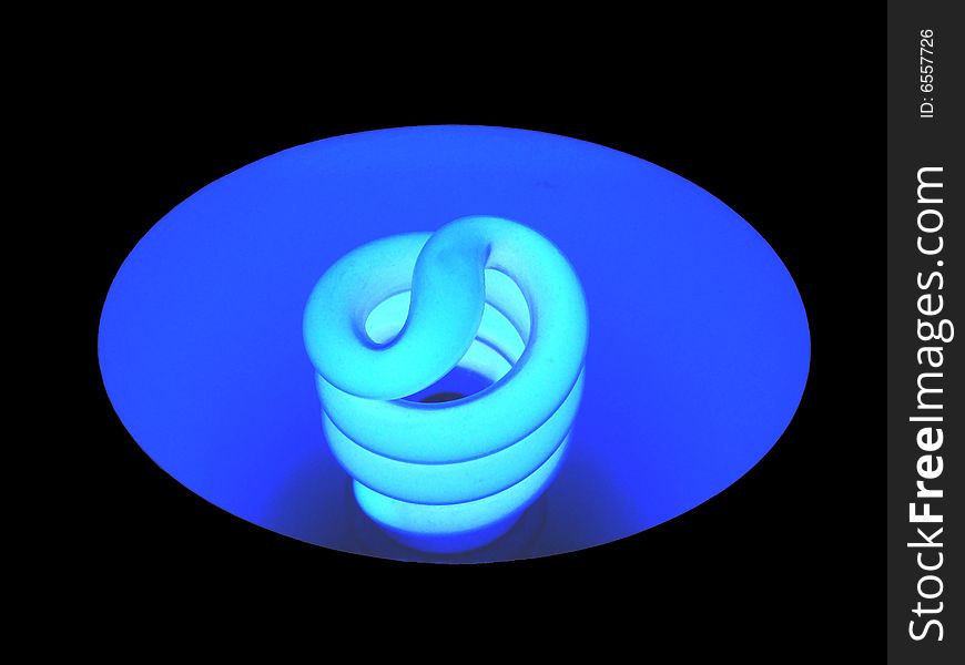 Blue fluorescent light bulb with black background. Blue fluorescent light bulb with black background.