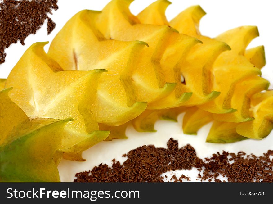 Starfruit decorated with ground chocolate. Starfruit decorated with ground chocolate