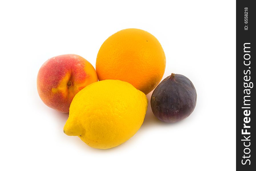 Peach and fig with orange and yellow lemon on white background