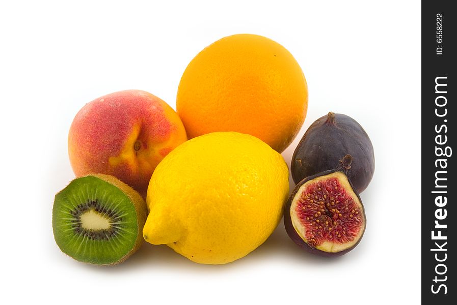 Yellow lemon and fig with other tasty fruit on white background