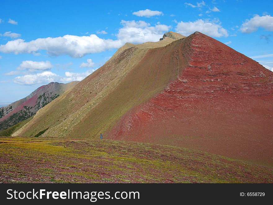 A red color mountain peak on Carthew-Alderson Trail in Waterton National Park Alberta Canada. A red color mountain peak on Carthew-Alderson Trail in Waterton National Park Alberta Canada