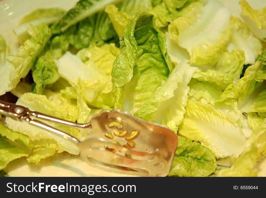 Bowl of fresh salad greens served at a dinner party