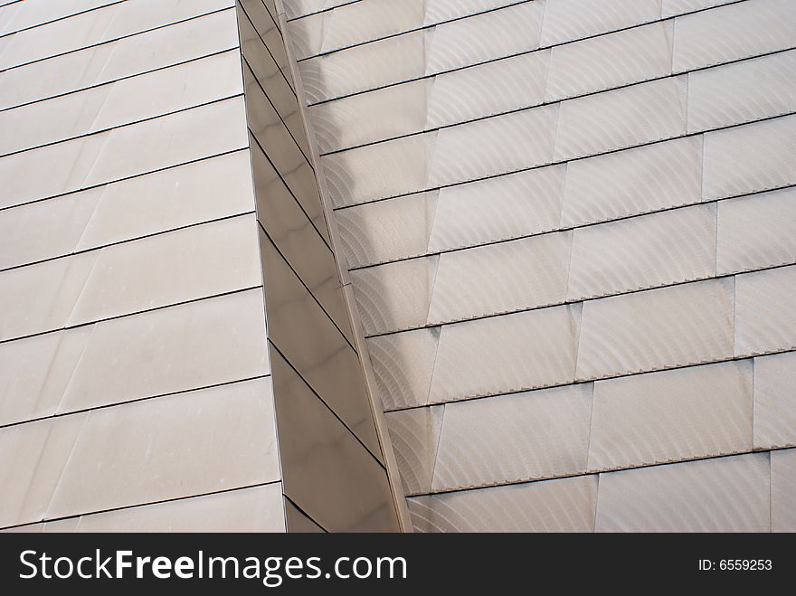 Steel panels on the outside of a building with arch patterns in the metal. Steel panels on the outside of a building with arch patterns in the metal