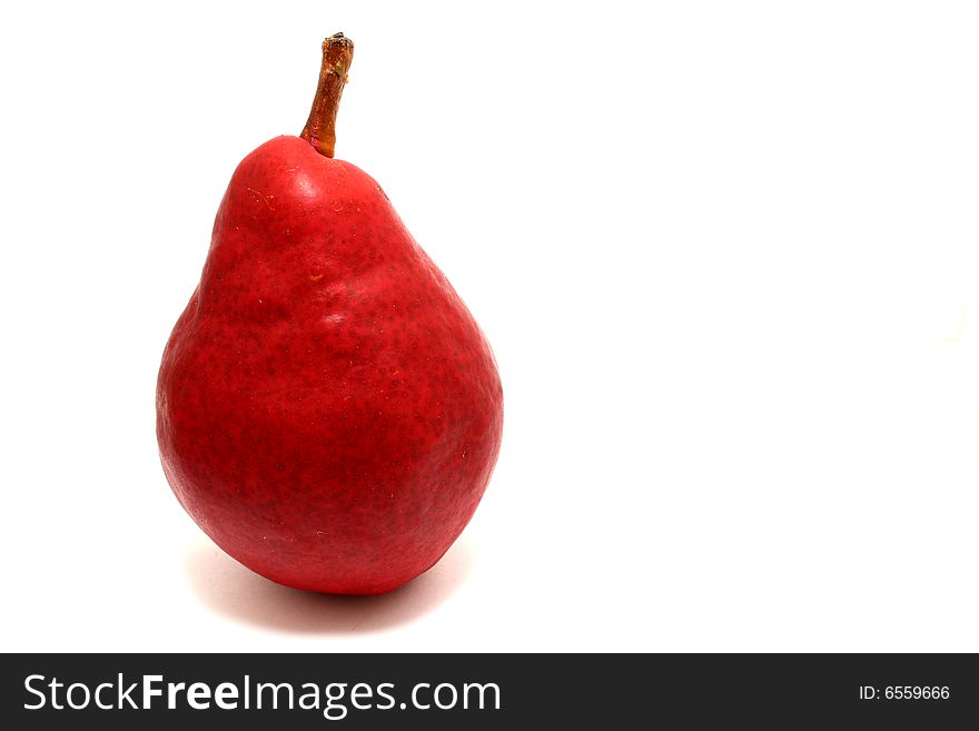 A red pear isolated on a white background.