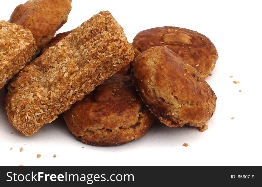 Cookies and crumbs on white surface