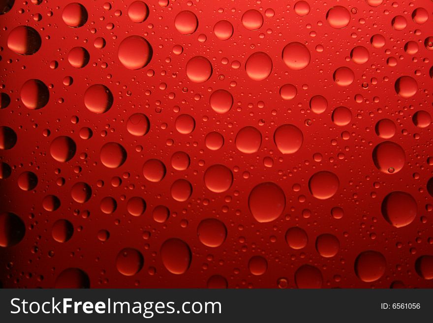 The red water drop on smooth surface. The red water drop on smooth surface